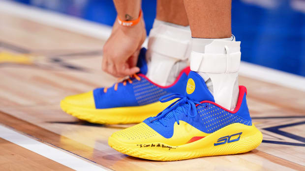 Stephen Curry's blue and gold Under Armour sneakers worn in the 2024 NBA All-Star Game.